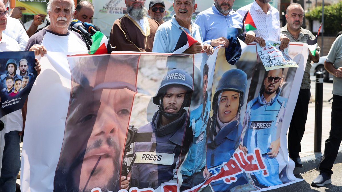 Demonstrators hold a poster featuring Reuters journalist Hussam al-Masri, Mohammed Salama, who worked for Qatar-based broadcaster Al Jazeera, Moaz Abu Taha, a freelance journalist who worked with several news organizations and occasionally contributed to Reuters, Mariam Abu Dagga, who freelanced for the Associated Press and other outlets, and Ahmed Abu Aziz, who were all killed in Israeli strikes on Nasser hospital in the southern Gaza Strip, during a protest in solidarity with journalists in Gaza, in Sidon, Lebanon, Aug. 27, 2025. (Reuters Photo)