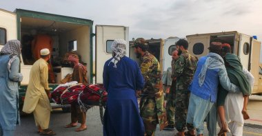 Soldiers and civilians carry earthquake victims to an ambulance at an airport in Jalalabad, Afghanistan, September 1, 2025. (Reuters Photo) 