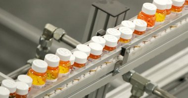 Bottles of medicine ride on a belt at a mail-in pharmacy warehouse in Florence, New Jersey, U.S., July 10, 2018. (AP Photo)