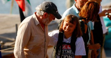 Swedish activist Greta Thunberg reacts with Irish actor Liam Cunningham as she arrives to take part in the Global Sumud Flotilla, a humanitarian expedition to Gaza, led by her and other activists, at the port of Barcelona, Spain, Aug. 31, 2025. (Reuters Photo)