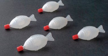 This photo shows plastic soy sauce fish containers. (Shutterstuck Photo)