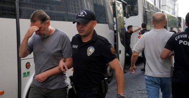 Some 45 suspects in the Istanbul Metropolitan Municipality corruption probe are escorted to court after undergoing medical examinations, Istanbul, Türkiye, Aug. 18, 2025. (AA Photo)