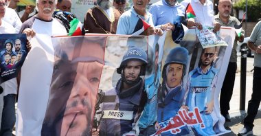 Demonstrators hold a poster featuring Reuters journalist Hussam al-Masri, Mohammed Salama, who worked for Qatar-based broadcaster Al Jazeera, Moaz Abu Taha, a freelance journalist who worked with several news organizations and occasionally contributed to Reuters, Mariam Abu Dagga, who freelanced for the Associated Press and other outlets, and Ahmed Abu Aziz, who were all killed in Israeli strikes on Nasser hospital in the southern Gaza Strip, during a protest in solidarity with journalists in Gaza, in Sidon, Lebanon, Aug. 27, 2025. (Reuters Photo)
