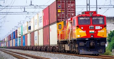 A freight train carrying cargo containers rides along a railway track, Ajmer, India, Aug. 26, 2025. (AFP Photo)