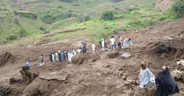 People inspecting the debris after a landslide devastated the village of Tarasin in Sudan's Jebel Marra area, Darufur, Sudan, Sept. 2, 2025. (AFP Photo)