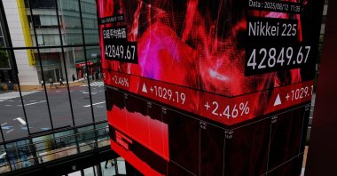 A display showing the Nikkei share average is pictured inside a financial building in Tokyo, Japan, Aug. 12, 2025. (Reuters Photo)