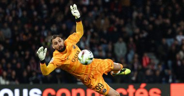 Paris Saint-Germain&#039;s Gianluigi Donnarumma makes a save during the French Ligue 1 football match against Olympique Lyonnais (Lyon) at the Parc des Princes stadium, Paris, France, April 21, 2024. (AFP Photo)