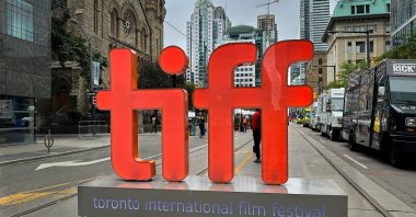 A large backlit “tiff” sign signals the entrance to the pedestrian only street festival in honor of the Toronto International Film Festival, Toronto, Canada, Sept. 9, 2023. (Shutterstock Photo)