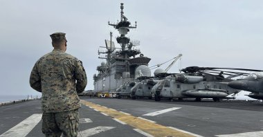 A marine walks on the deck of the amphibious assault ship USS Bataan that is docked at Larnaca port, Greek Cypriot administration, Feb. 13, 2024. (AP File Photo)