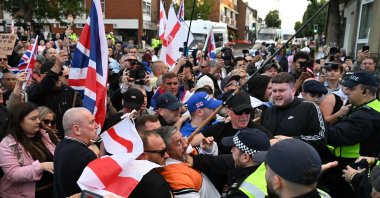 Police officers and protesters scuffle outside the council offices in Epping after an anti-migrant march from the Bell Hotel, which houses asylum seekers, northeast of London, U.K., Aug. 31, 2025. (AFP Photo)