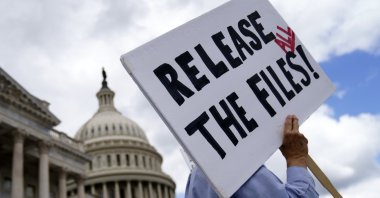 A protester carries a placard outside the U.S. Capitol in Washington, D.C., U.S., Sept. 2, 2025. (EPA photo)