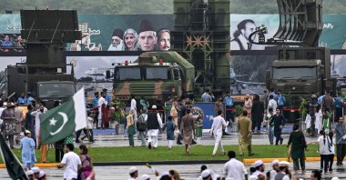  People gather around an army air defense system on display at a military exhibition during Independence Day celebrations in Islamabad, Aug.14, 2025. (AFP Photo)