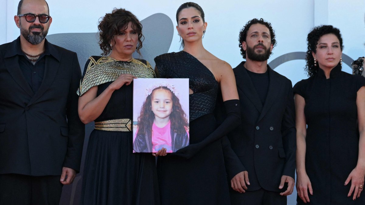 The director and cast of &quot;The Voice of Hind Rajab&quot; pose with a portrait of the late Palestinian girl Hind Rajab on the red carpet at the 82nd Venice International Film Festival, Venice, Italy, Sept. 3, 2025. (AFP Photo)