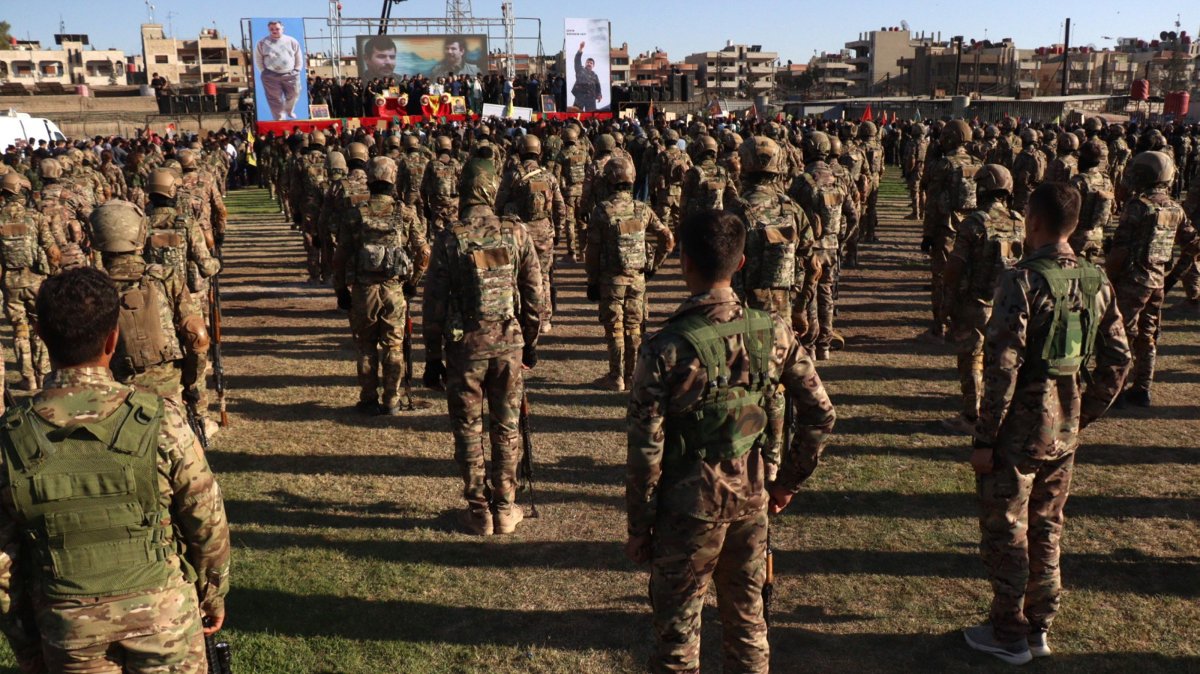 YPG terrorists attend the funeral of a senior PKK terrorist killed in 2021, in Qamishli, northeastern Syria, Aug. 12, 2025. (EPA Photo)