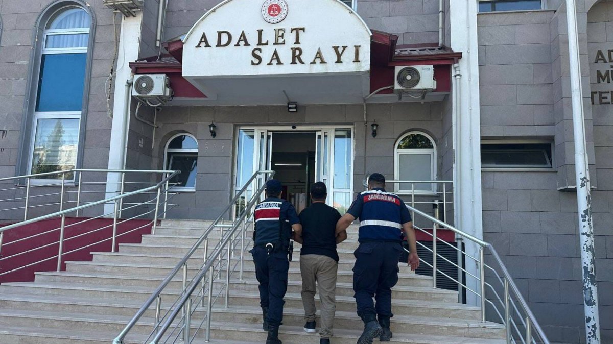 Officers escort a fugitive FETÖ suspect captured in an operation, in Adıyaman, southern Türkiye, Aug. 5, 2025. (AA Photo)