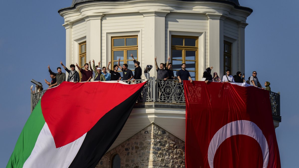 Turkish and Palestinian flags hang from the Maiden’s Tower during a pro-Gaza event organized by the Open Rafah movement on the Bosporus in Istanbul, Aug. 28, 2025. (AA File Photo)