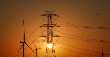 The sun sets behind wind turbines in Silivri, Istanbul, Türkiye, Aug. 16, 2025. (Reuters Photo)