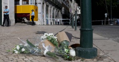 Flowers in tribute to the victims are pictured on the site of the Gloria funicular railway a day after the accident in Lisbon, Portugal, Sept. 4, 2025. (AFP Photo)