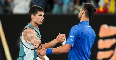 Serbia&#039;s Novak Djokovic (R) shakes hands with Spain&#039;s Carlos Alcaraz after their Men&#039;s Singles Quarter Finals match during day ten of the 2025 Australian Open at Melbourne Park, Melbourne, Australia, Jan. 21, 2025. (Getty Images Photo)