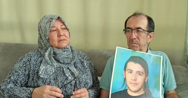 Zuhal Dölek (L) and Hasan Dölek, parents of Furkan Dölek, wait for news of their son in Kozan, Adana, Türkiye, Sept. 2, 2025. (AA Photo)