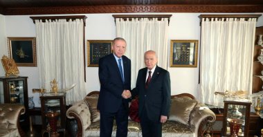 President Recep Tayyip Erdoğan, MHP Chairman Devlet Bahçeli shake hands during a meeting in Ankara, Sept. 5, 2025. (DHA Photo)