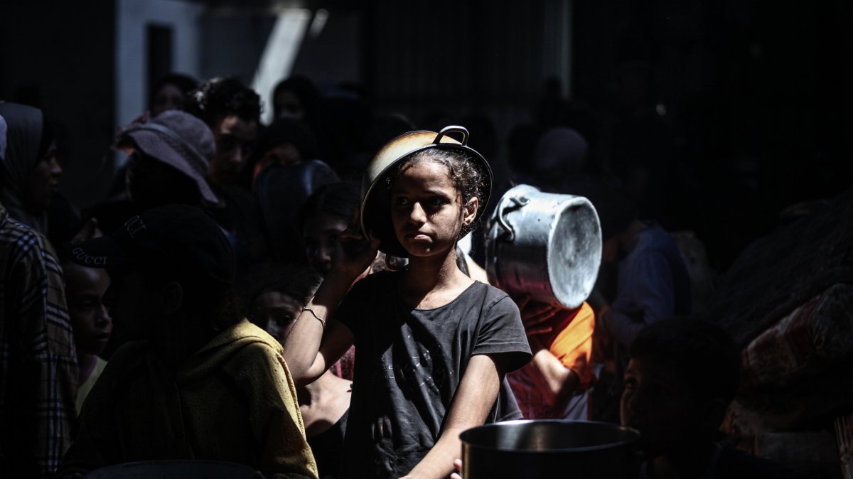 A large number of Palestinians, including children, gather in order to get food in Nuseirat Refugee Camp, Gaza, Palestine, Sept. 3, 2025. (AA Photo)