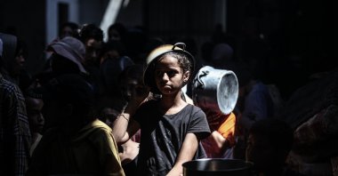 A large number of Palestinians, including children, gather in order to get food in Nuseirat Refugee Camp, Gaza, Palestine, Sept. 3, 2025. (AA Photo)