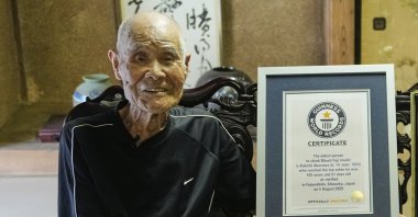 Kokichi Akuzawa, recently recognized by Guinness World Records as the oldest person to climb Mount Fuji (male), poses for a photo with his Guinness certificate, Maebashi, Tokyo, Sept. 3, 2025. (AP Photo)