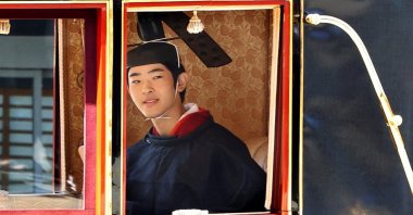 Japanese Prince Hisahito, son of Crown Prince Akishino, wearing ancient ceremonial costume leaves for a ceremony by a carriage at the Imperial Palace in Tokyo, Japan, Sept. 6, 2025. (Reuters Photo)