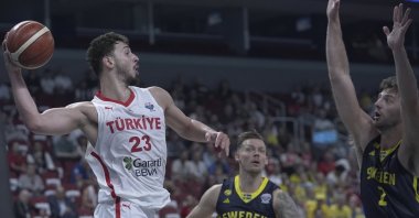Türkiye&#039;s Alperen Şengün in action with Sweden&#039;s Adam Ramstedt at Xiaomi Arena, in Riga, Latvia, Sept. 6, 2025. (AA Photo)