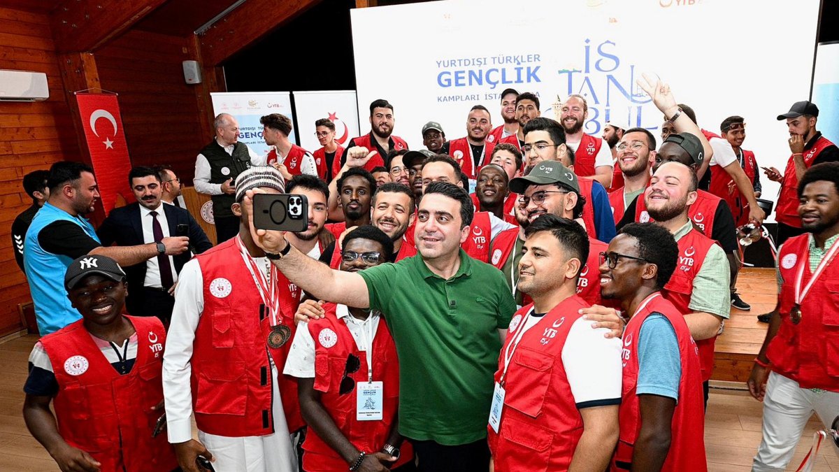 Youth from 58 countries take a photo with the Presidency for Turks Abroad and Related Communities President Abdulhadi Turus at Marmaracık Youth Camp, Istanbul, Türkiye, Sept. 7, 2025. (AA Photo)