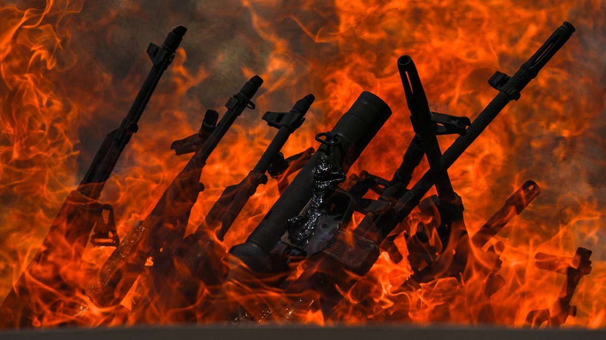 Weapons placed by PKK terrorists are burned during a disarmament ceremony, Sulaimaniya, Iraq, July 11, 2025. (AA Photo)