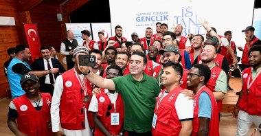 Youth from 58 countries take a photo with the Presidency for Turks Abroad and Related Communities President Abdulhadi Turus at Marmaracık Youth Camp, Istanbul, Türkiye, Sept. 7, 2025. (AA Photo)