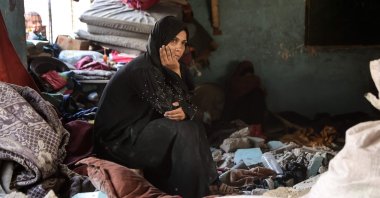 A displaced Palestinian woman sits amid the rubble inside a classroom of the al-Farabi school turned shelter, after it was hit by an Israeli strike, in Gaza City in the northern Gaza Strip, Palestine, Sept. 7, 2025. (AFP Photo)