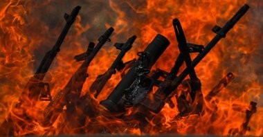 Weapons placed by PKK terrorists are burned during a disarmament ceremony, Sulaimaniya, Iraq, July 11, 2025. (AA Photo)