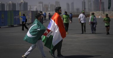 India and Pakistani fans arrive together to watch the ICC Champions Trophy cricket match, Dubai, UAE, Feb. 23, 2025. (AP Photo)