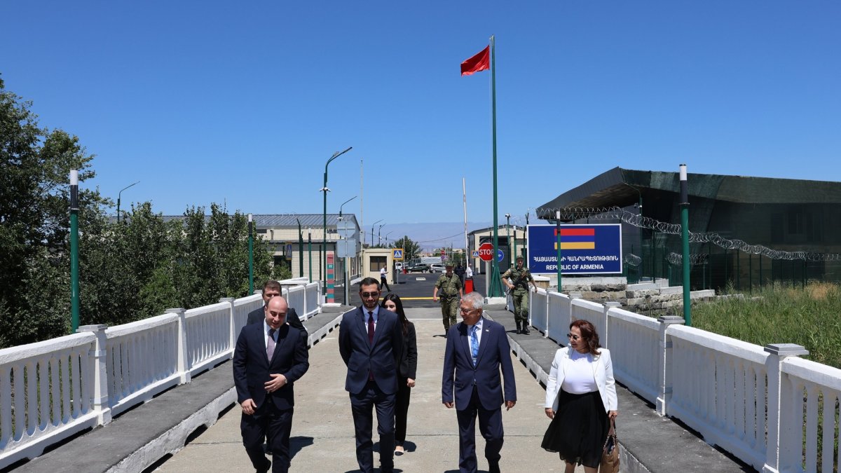 Türkiye&#039;s representative, Ambassador Serdar Kılıç (2nd R), and Armenia&#039;s representative, Ruben Rubinyan (2nd L), walk on the border between the two countries, July 30, 2024. (AA Photo)