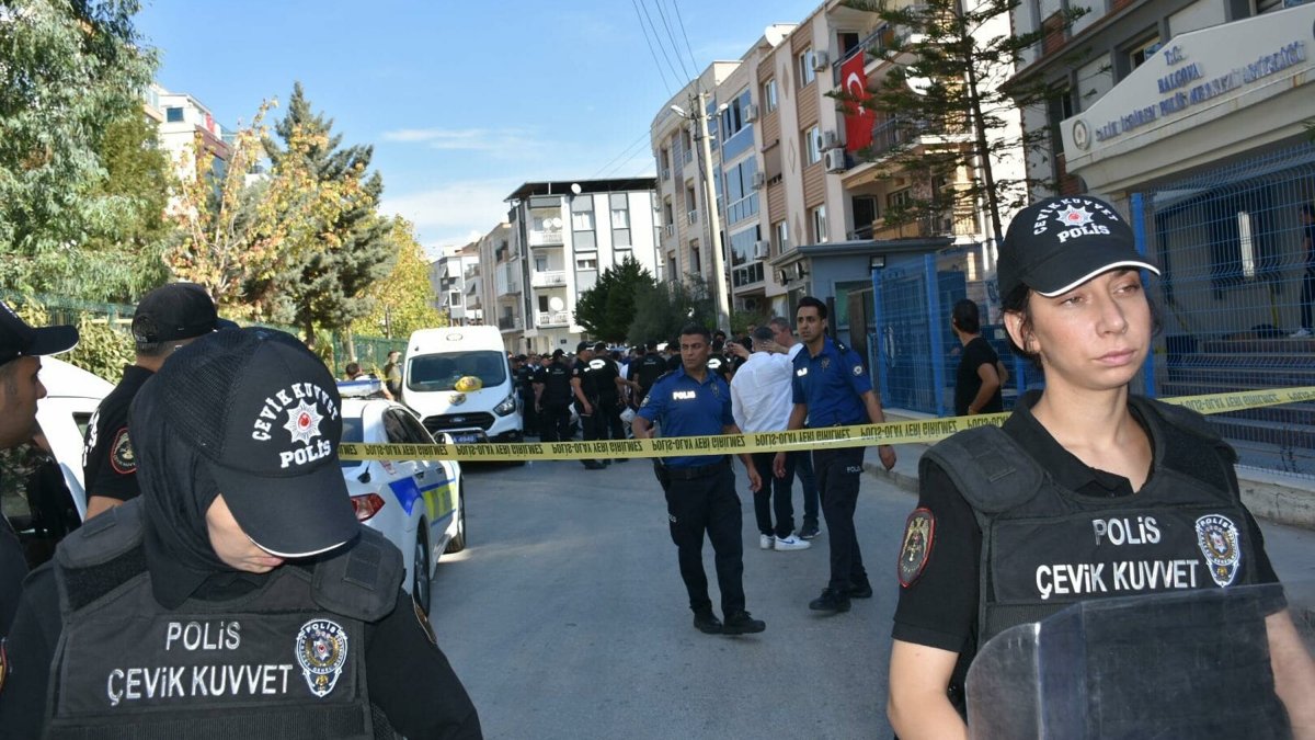 Police officers stand guard at the scene of a shooting incident at a police station in western Izmir province, Türkiye, Sept. 8, 2025. (DHA Photo)