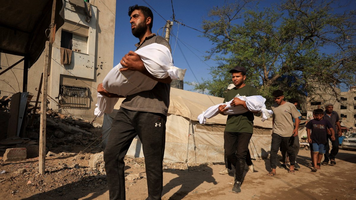 Mourners carry the bodies of Palestinian sisters Layan Salem, 2, and Eman Salem, 5, who were killed in an overnight Israeli strike on a tent in Gaza City, Palestine, Sept. 8, 2025. (Reuters Photo)