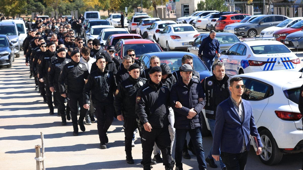 Turkish police escort suspects detained over FETÖ links to the courthouse in southern Antalya province, Türkiye, Feb. 24, 2025. (AA Photo)