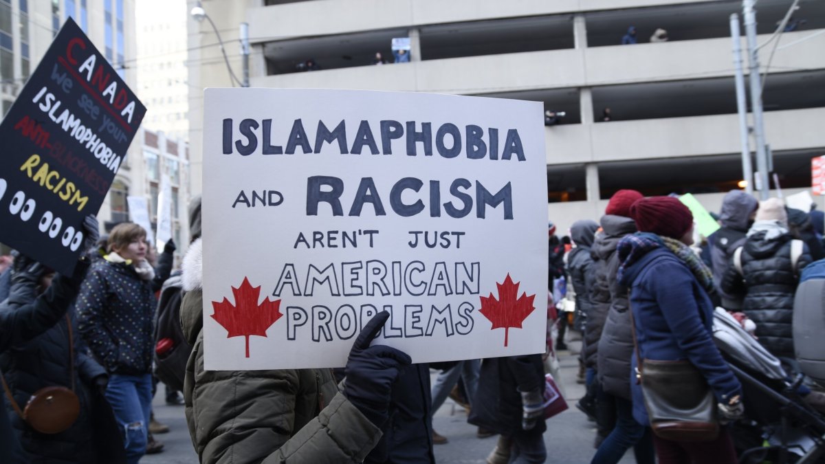 People with posters rejecting racism and Islamophobia during a rally in Toronto, Canada, Feb. 4, 2017. (AP File Photo)