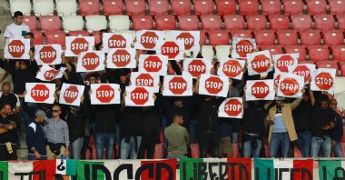 Italy fans hold banners in protest inside the stadium before World Cup qualifiers Group I match against Italy at the Nagyerdei Stadion, Debrecen, Hungary, Sept. 8, 2025. (Reuters Photo)