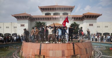 Demonstrators celebrate after entering the Parliament complex during an anti-government protest, Kathmandu, Nepal, Sept. 9, 2025. (Reuters Photo)