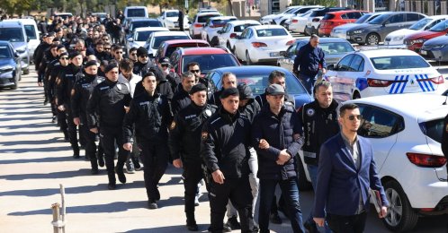 Turkish police escort suspects detained over FETÖ links to the courthouse in southern Antalya province, Türkiye, Feb. 24, 2025. (AA Photo)