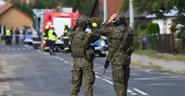 Polish Army and emergency services inspect the site after a Russian drone damaged the roof of a residential building in Wyryki, eastern Poland, Sept. 10, 2025. (EPA Photo)