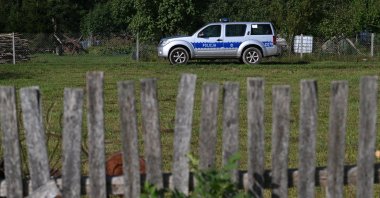 Police at the site after a Russian drone damaged the roof of a residential building in Wyryki, eastern Poland, Sept. 10, 2025. (EPA Photo)