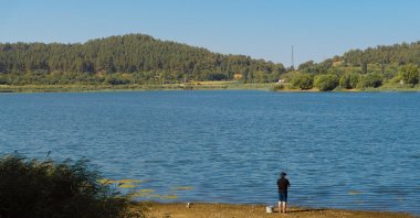 Gölcük Lake, surrounded by pine forests and popular for camping and fishing during the summer, attracts visitors amid the heat, Izmir, Türkiye, Aug. 28, 2025. (AA Photo)