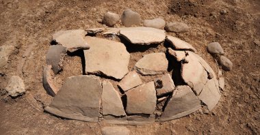 Ancient graves unearthed by members of the Dohuk Antiquities Department on the banks of Mosul Dam on an archaeological site in the Khanke, Dohuk, Iraq, Aug. 30, 2025. (AFP Photo)