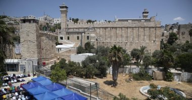 Palestinians pray during Friday prayers at a protest against Israeli construction access to alter the status of the Ibrahimi Mosque, in the city of Hebron, occupied West Bank Friday, Aug. 13, 2021. (AP File Photo)
