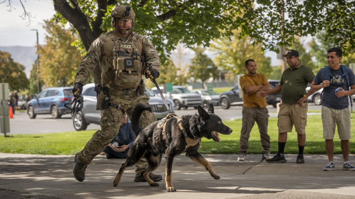 A police officer walks with a K9 Unit following the shooting of Charlie Kirk, in Orem, Utah, U.S., Sept. 10, 2025. (EPA Photo)